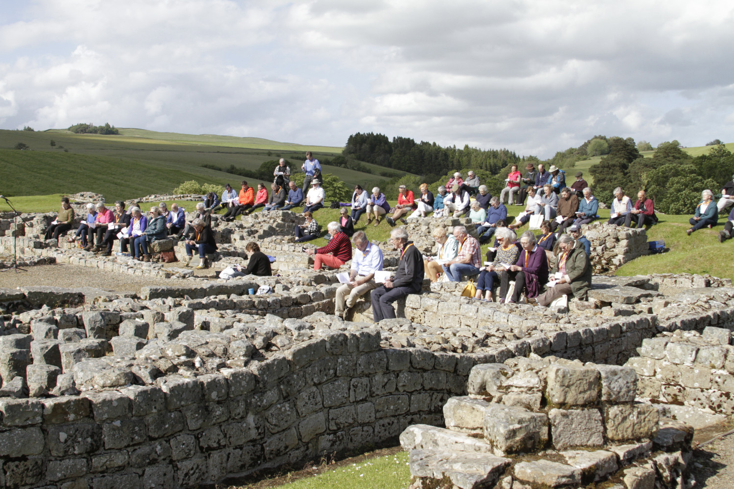A large group of people gather in Vindolanda for the opening worship